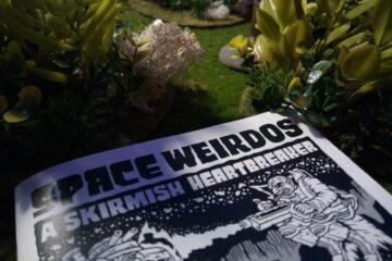Space Weirdos rulebook on the gaming table.
