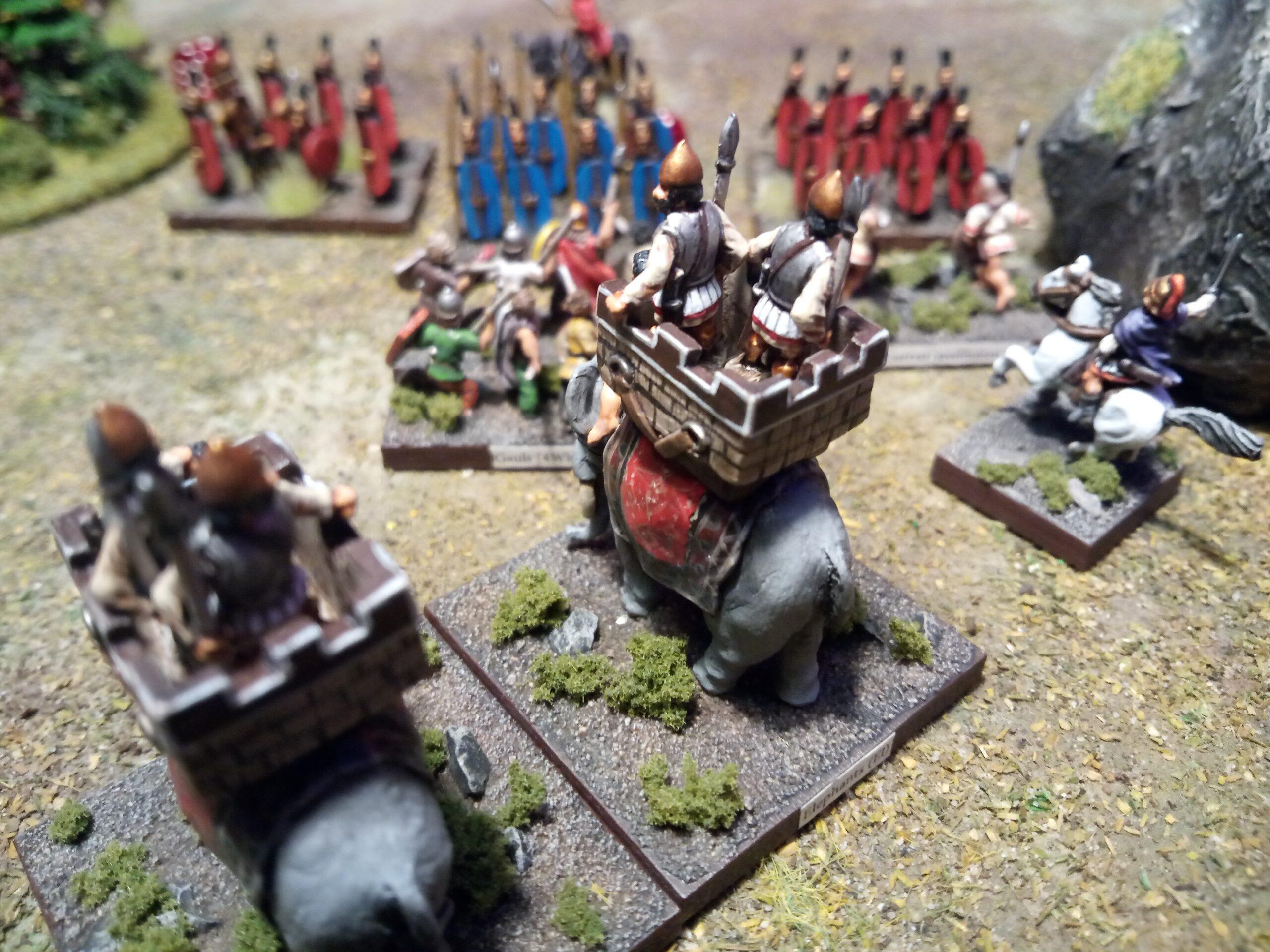 While waiting for their turn to smash their enemies the War Elephant's crew fire on the Roman lines in this game of Kings of War Historical.