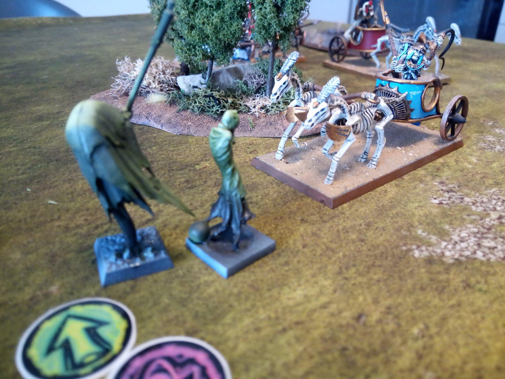 Vampiric Undead Wraiths being destroyed by Mummified Undead chariot in the Danse Macabre scenario for One Page Rules Age of Fantasy.