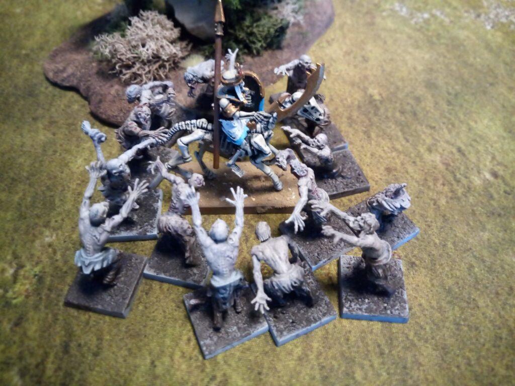 Vampiric Undead Zombies attacking Mummified Undead rider in the Danse Macabre scenario for One Page Rules Age of Fantasy.