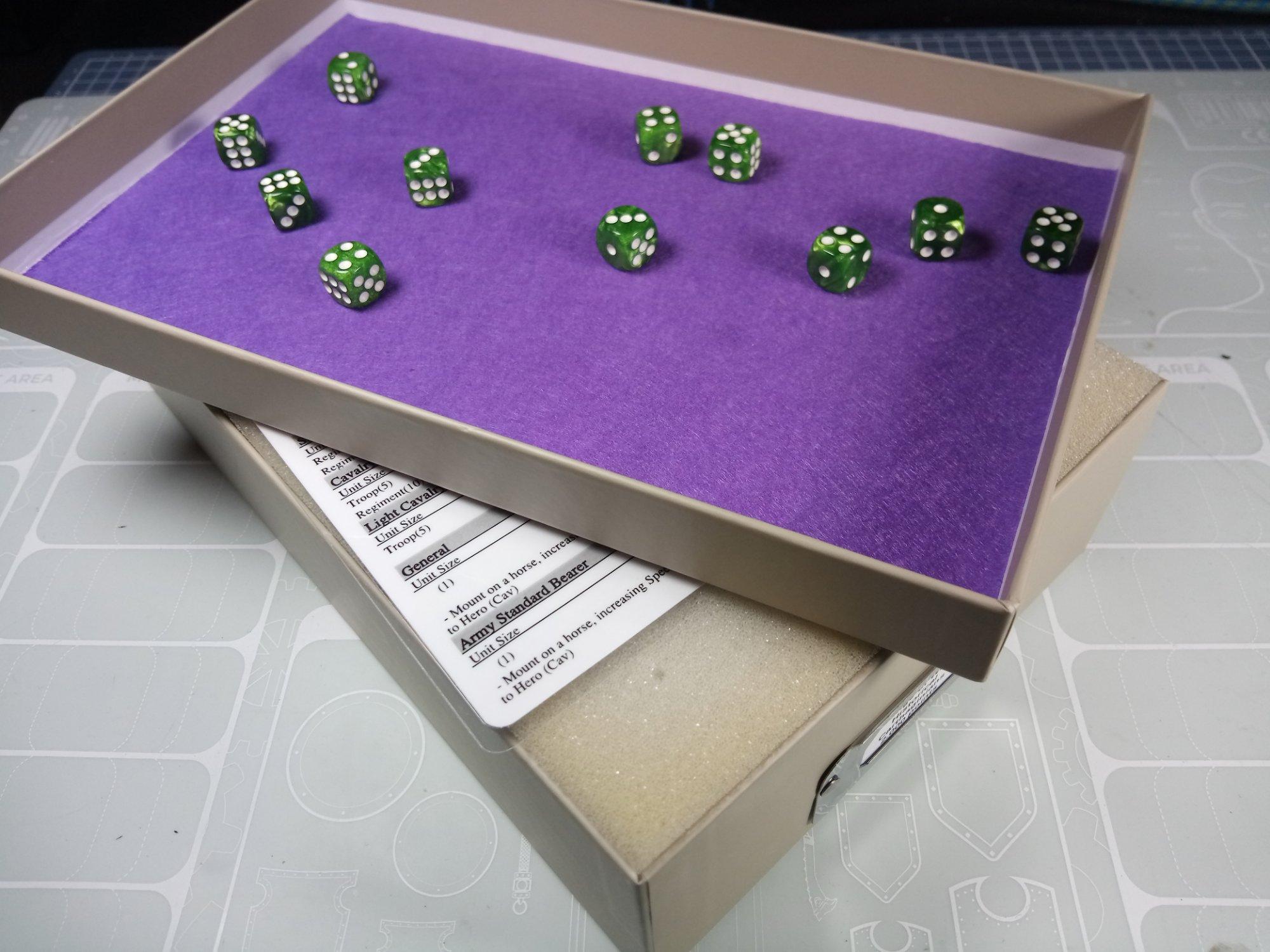 The felt inside the lid of the DIY Miniature storage box works as a dice tray.